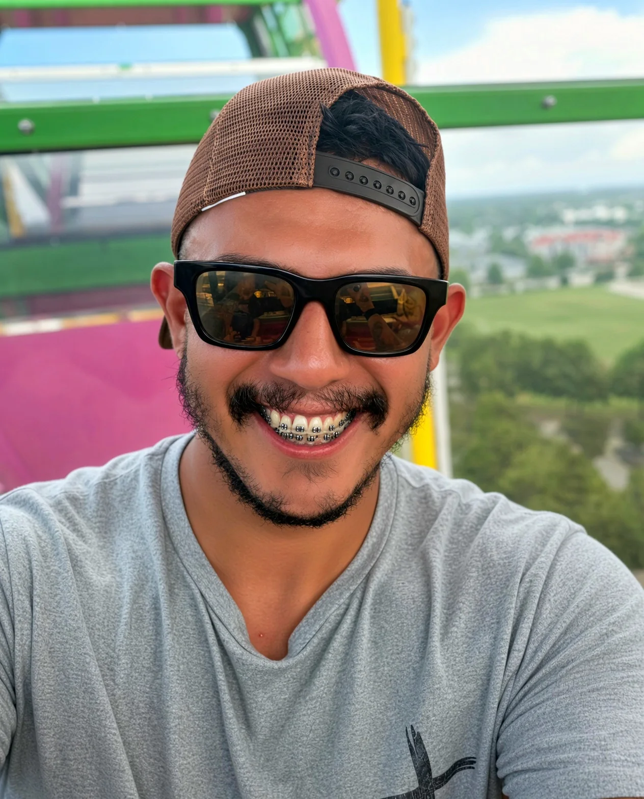 Alex smiling outdoors
